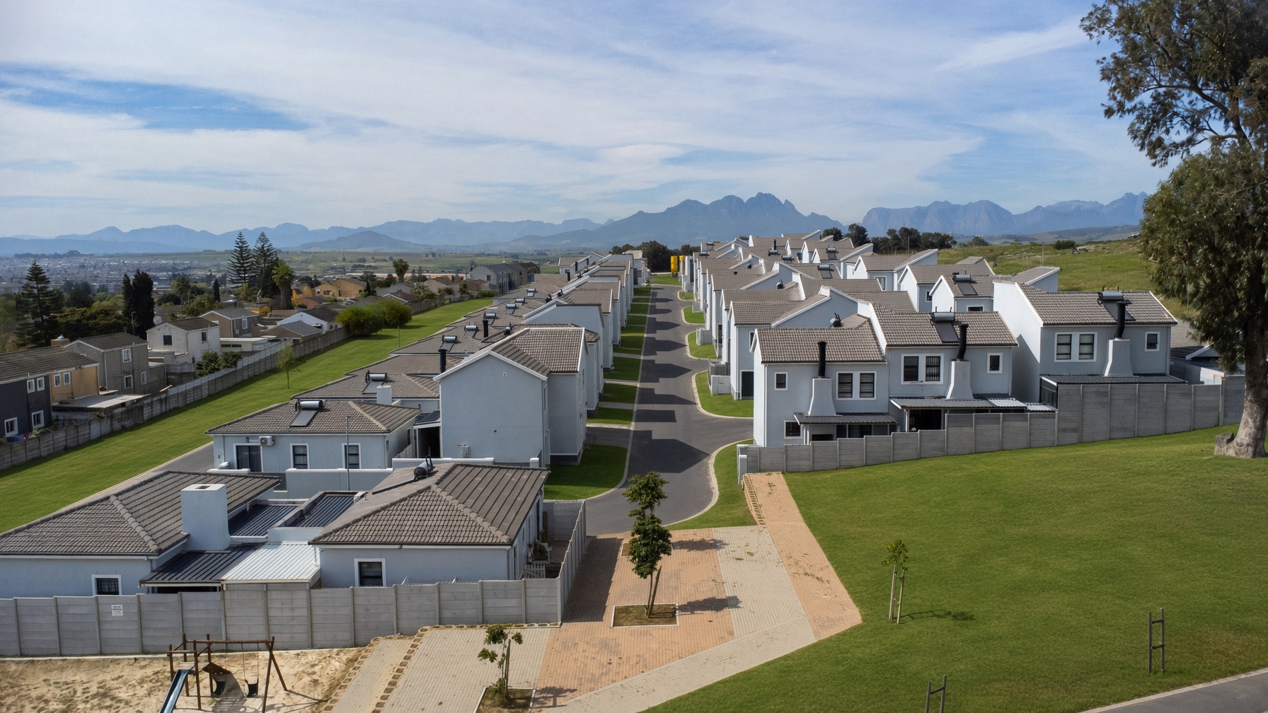 Aerial view over completed Bracken Reserve homes with the Boland mountains behind