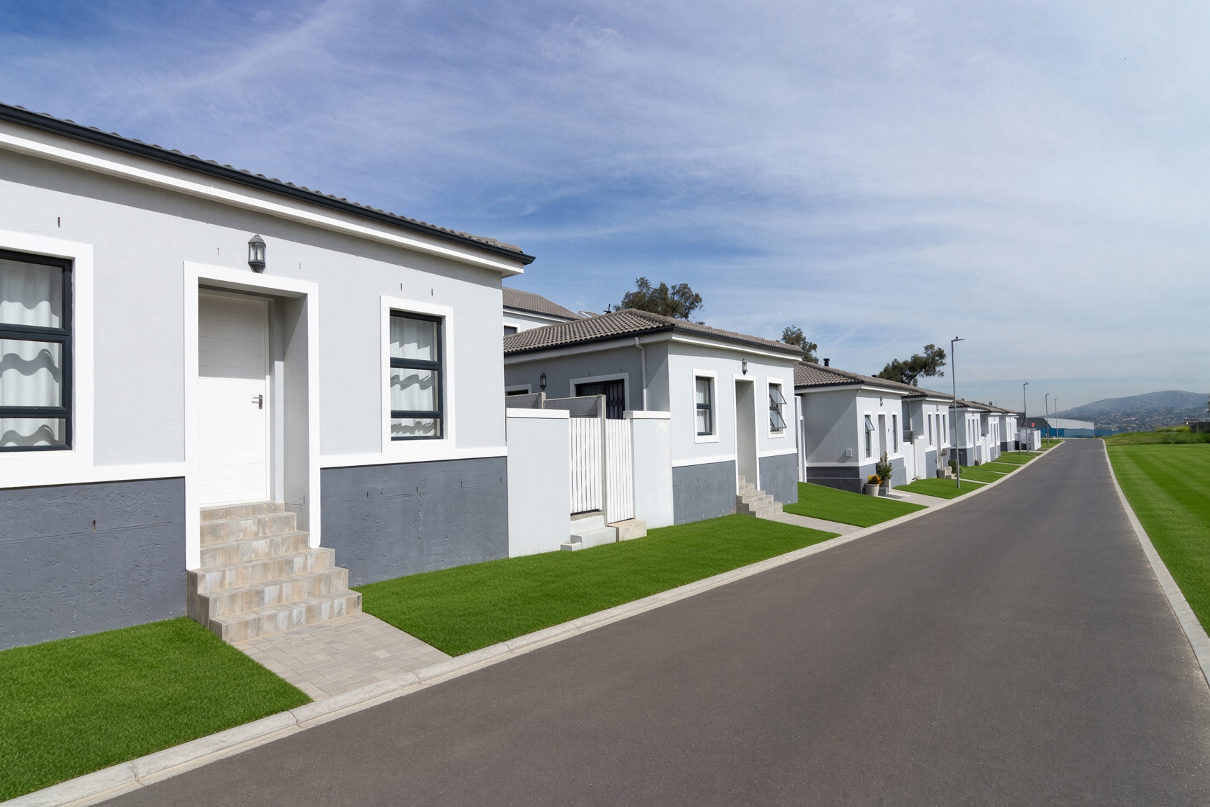 Completed single-storey Bracken Reserve homes along a street